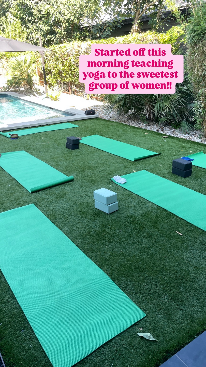 Green yoga mats and blocks set up on the lawn beside a pool at an Austin rental for a private bachelorette yoga class, with the caption 'Started off this morning teaching yoga to the sweetest group of women!!'